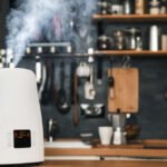 Healthy air. The humidifier distributes steam in the kitchen in loft style.