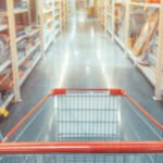 Abstract blurred photo of hardware store with empty shopping car